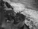 An Oerlikon gun crew in action on HMS Naiad, December 1941. @ IWM ( A7594)